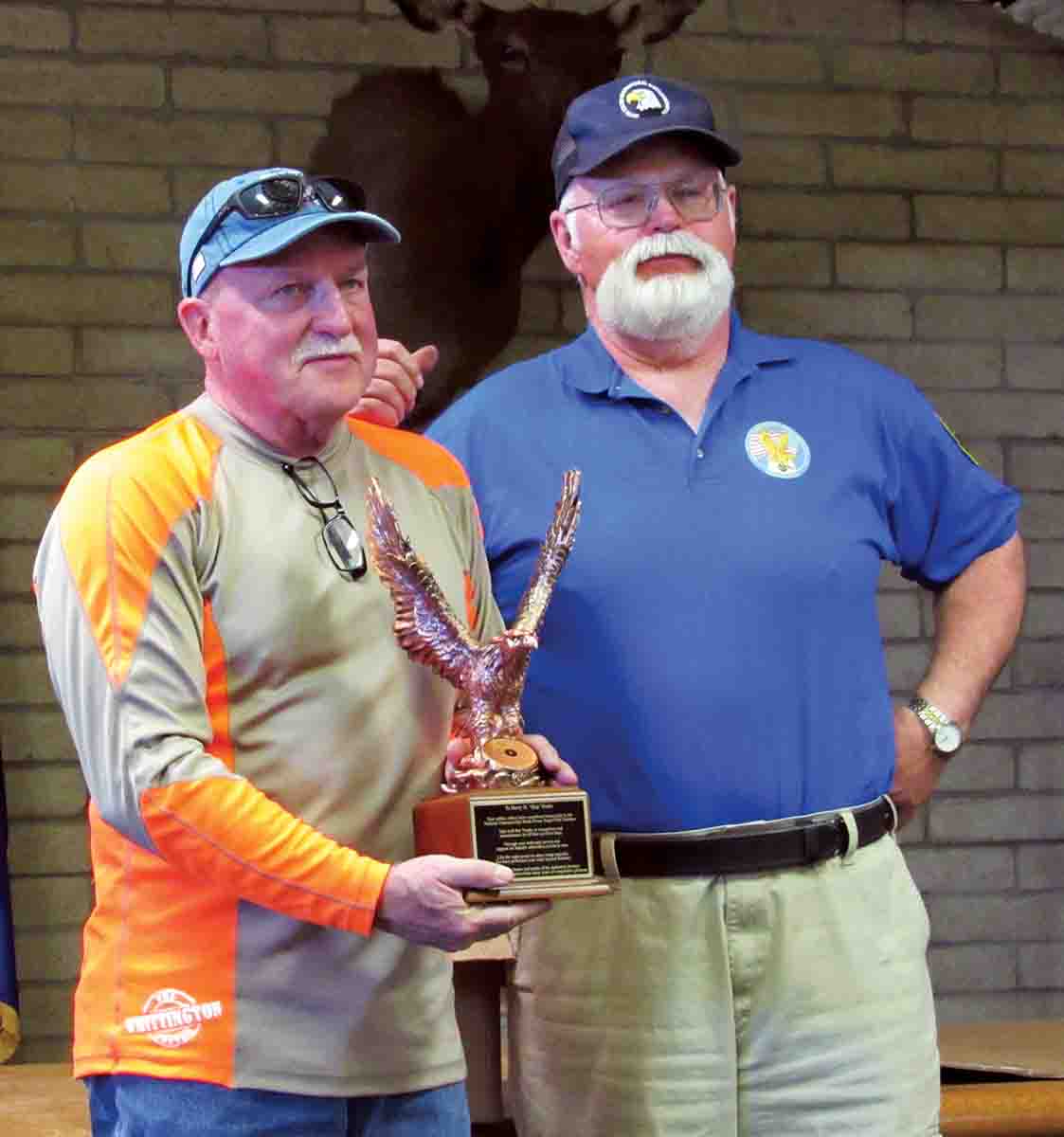 Harry “Skip” Burks (left) accepting the Eagle Award from Ray Hanson.